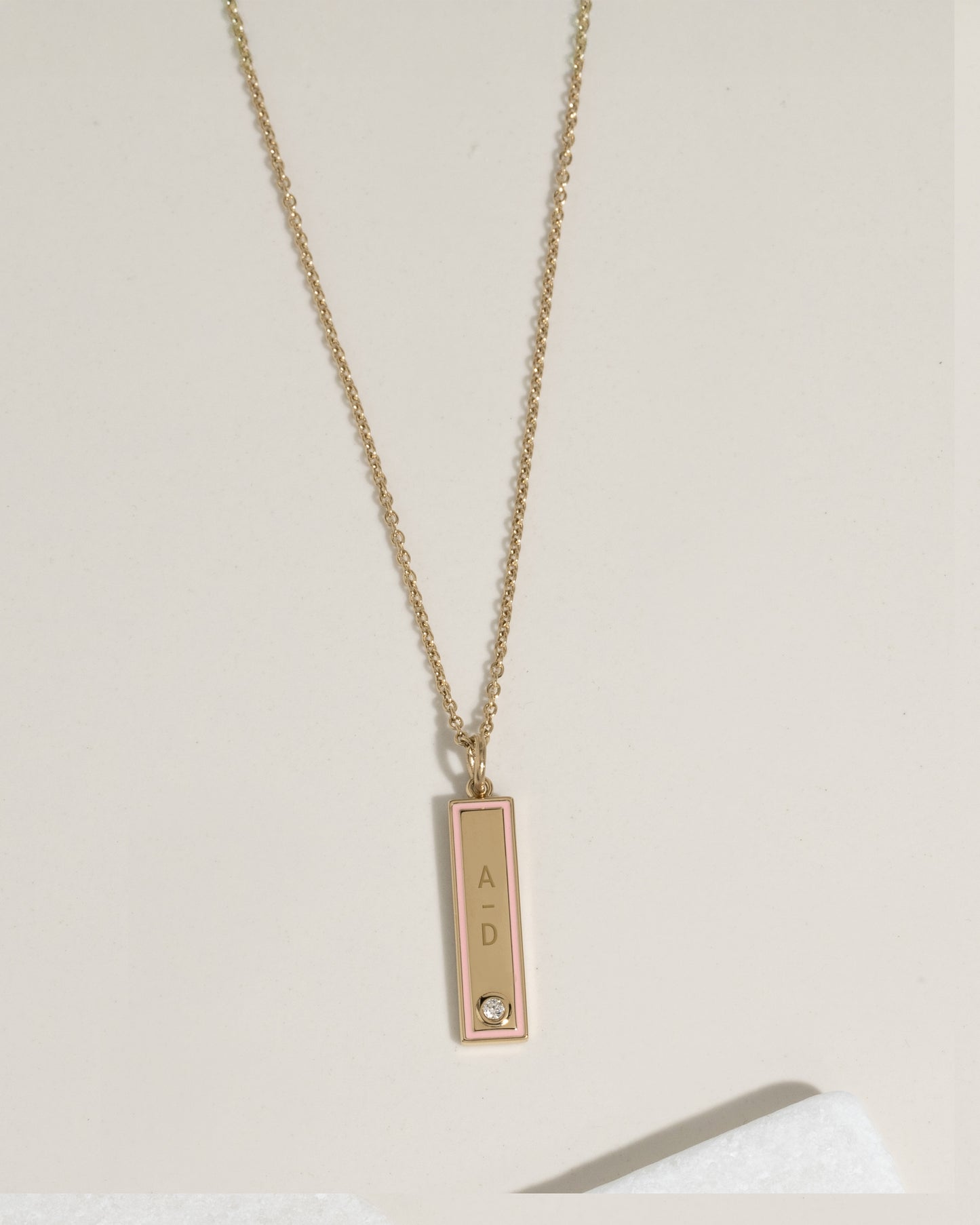 Gold necklace with personalized pink enamel bar pendant